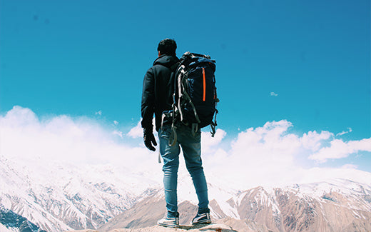 Climber standing on a cold mountain top