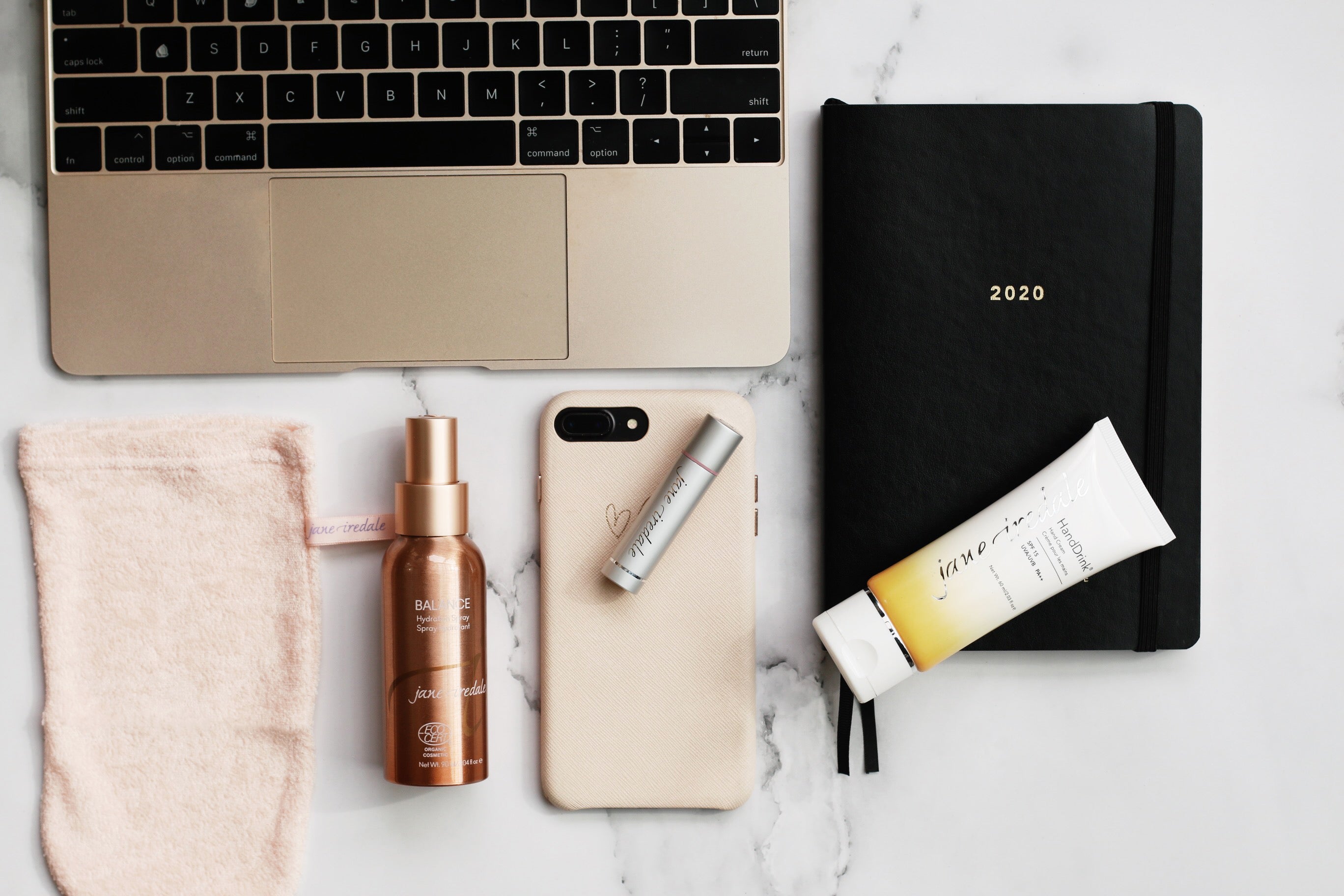 working from home beauty essentials include a magic mitt, lipdrink lip balm, hydration spray and HandDrink Hand Cream