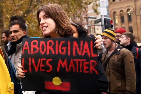 Protesters during the Black Deaths in Custody Protest at Town Hall in Sydney in 2018, via sbs.com.au