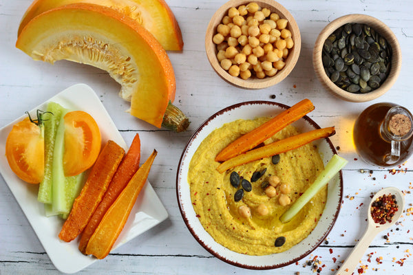 Pumpkin hummus board with vegetable sticks