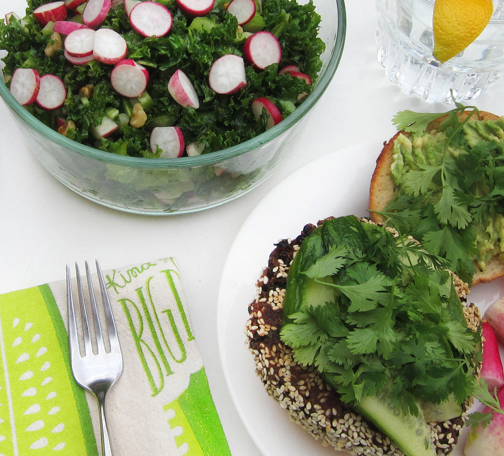 veggie burger and salad topped with cilantro