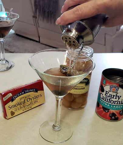 Shake mixture and pour into Martini Glass with Garnish