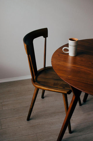 A Wooden Dining Chair With Seat Scoop