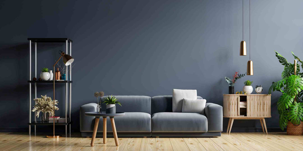 Image showcasing color scheme ideas for home renovation, highlighting the bold monochromatic concept in a dark blue-grey living room. Emphasizes a single color tone, creating a striking and dramatic effect. The dark blue-grey palette brings depth and richness to the space, adding a sense of sophistication and modernity to the living room interior