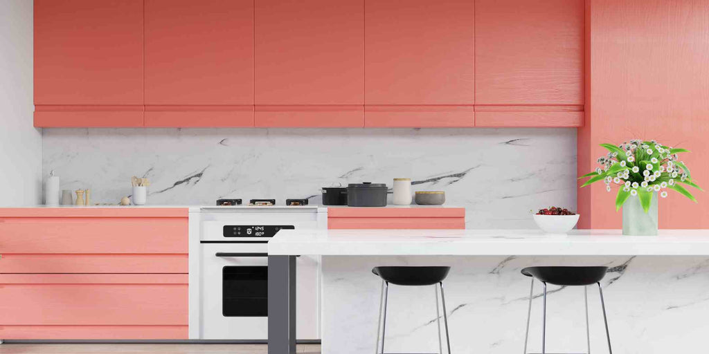 Image representing a 2023 trend in Executive Maisonette renovations: injecting color with confidence. The photo showcases a trendy kitchen with bold, tangerine-colored cabinets, demonstrating a vibrant move away from traditional neutrals to create a lively, personalised space.
