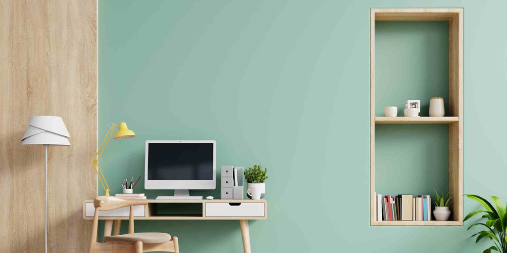 Image showcasing a 2023 trend in Executive Maisonette renovations: maximising vertical space. The photo features a green wall with wall-mounted open shelves, effectively utilizing the room's height for additional storage and display while adding visual interest and depth.