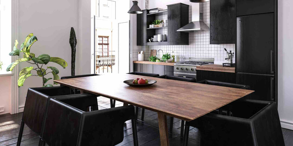 Image demonstrating a 2023 trend in Executive Maisonette renovations: the industrial style. The photo showcases a kitchen and dining area featuring raw materials, exposed structures, and a neutral palette, encapsulating the edgy, raw aesthetic characteristic of industrial design.