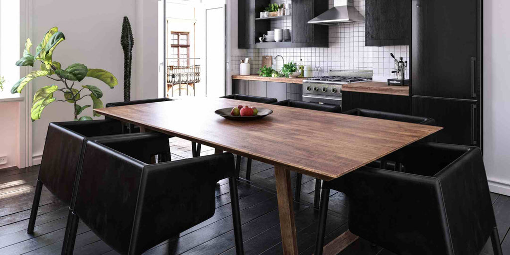 Photograph displaying a dining table made from reclaimed wood, illustrating how renovation services are incorporating sustainable materials for a greener future. This visual example shows the beauty and practicality of using recycled or reclaimed materials, encouraging a more environmentally responsible approach to home renovation.