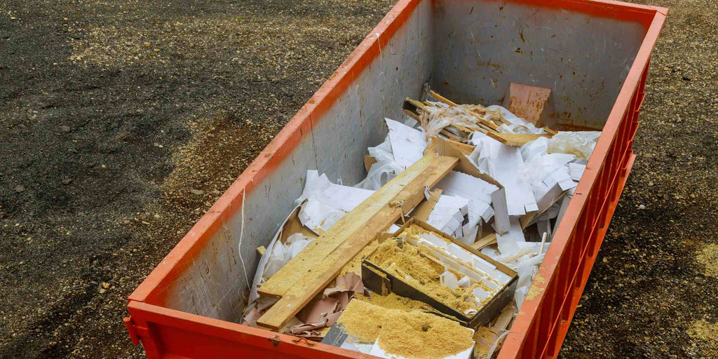 Photograph showcasing a construction debris waste disposal system, exemplifying how renovation services are incorporating green tech in the form of waste management for a sustainable future. The image underscores the importance of proper disposal and recycling methods in renovation projects to reduce environmental impact.