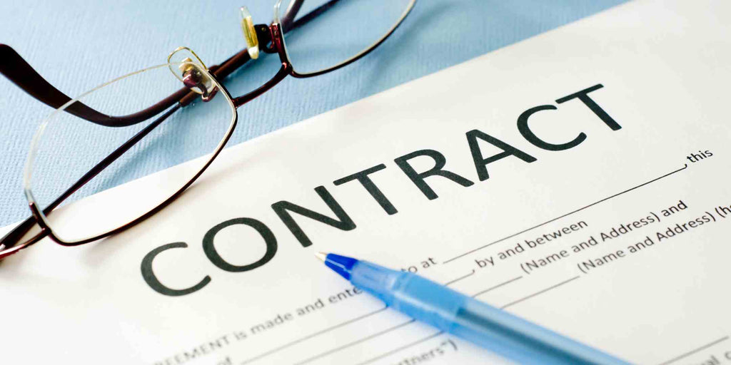 Close-up view of a contract document, emphasizing the critical importance of thorough and transparent agreements for ensuring a safe and trustworthy home renovation experience.