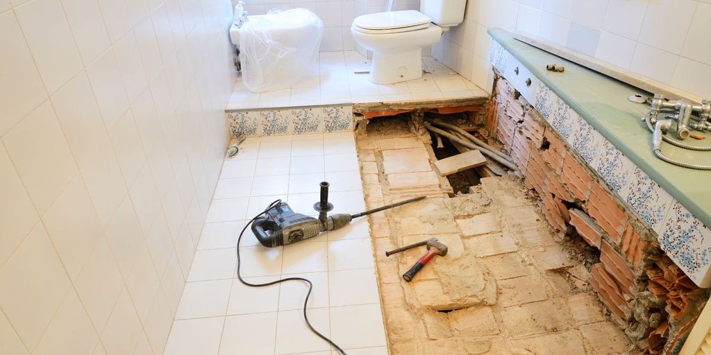 An image of a bathroom floor, representing the structural restrictions associated with HDB flat renovations, highlighting the need for homeowners to understand the limitations and guidelines around bathroom renovations to ensure safety and compliance