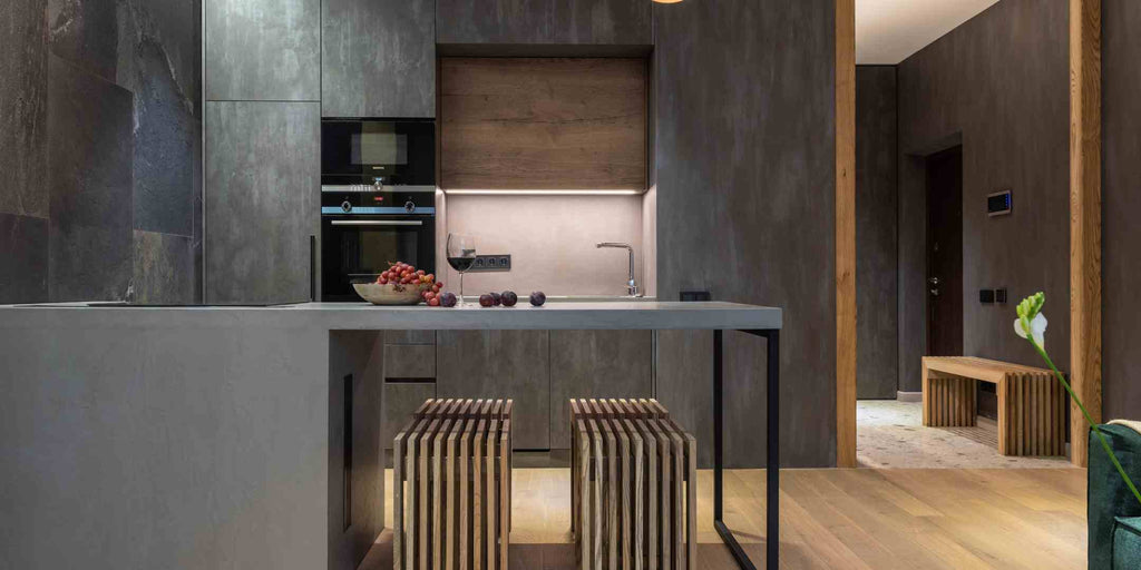 Image of an industrial-style kitchen in a renovated flat, accompanied by the title 'Tips for Managing Your Singapore Renovation Costs Effectively.' This picture suggests ways to maintain an appealing design while managing the cost of a renovation project effectively.
