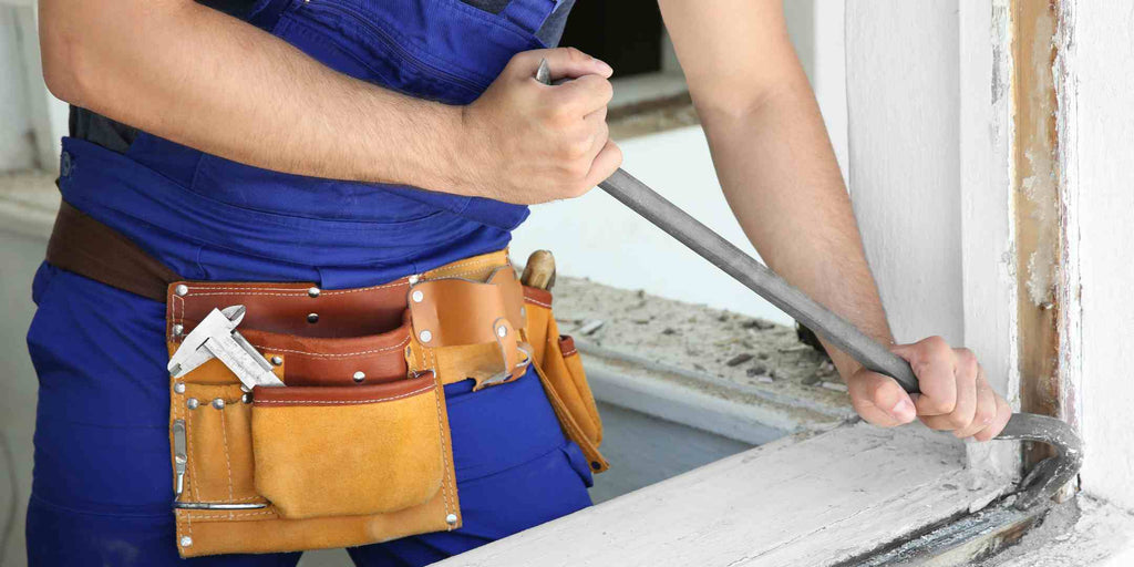 Image illustrating a dramatic stage of home transformation: the hacking of a flat's structure during renovation. The picture serves as a powerful reminder of the importance of securing a residential renovation permit in Singapore, reinforcing the necessity of following regulations for safety and compliance in complex home improvement projects.