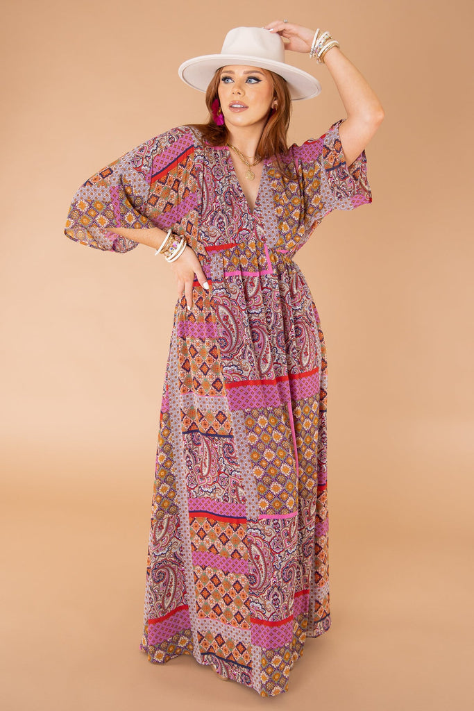 A woman in a baby-doll maxi dress