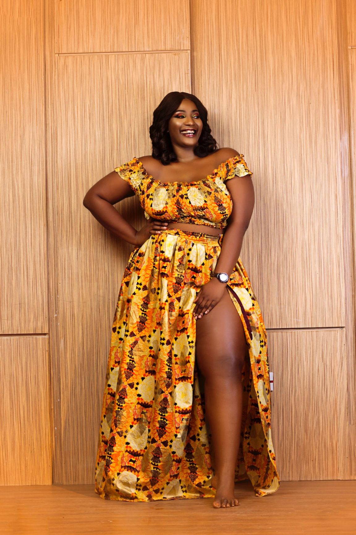 A plus-size woman wearing an outfit with bright prints