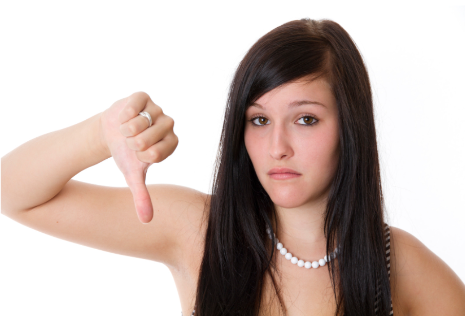 young-unhappy-woman-thumbs-down-on-a-white-background