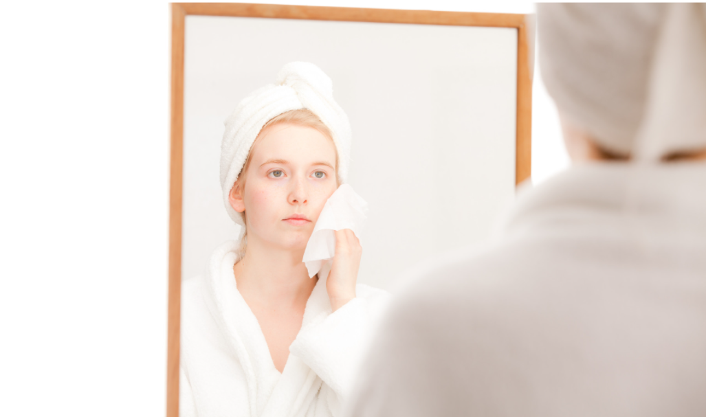 asian-woman-removing-makeup-in-front-of-the-mirror