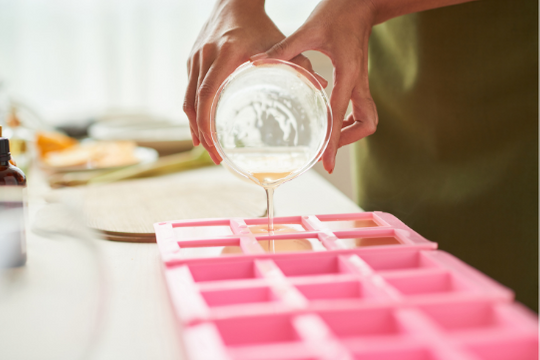 pouring homemade glycerin pink silicon tray