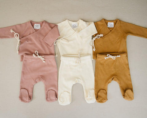 Organic layettes sets for newborns in blush pink, vanilla white and yellow mustard