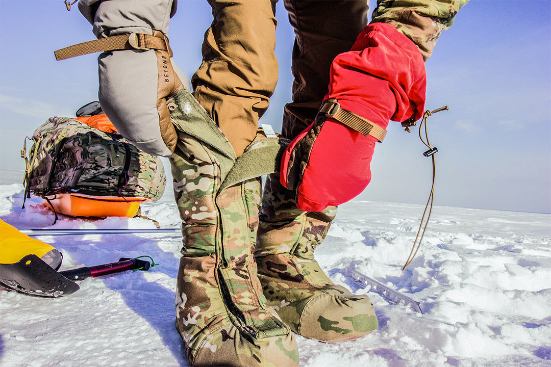 Product tester showing how quickly the Warmfoot Overboots can be taken on and off while on Lake of the Woods in Minnesota.