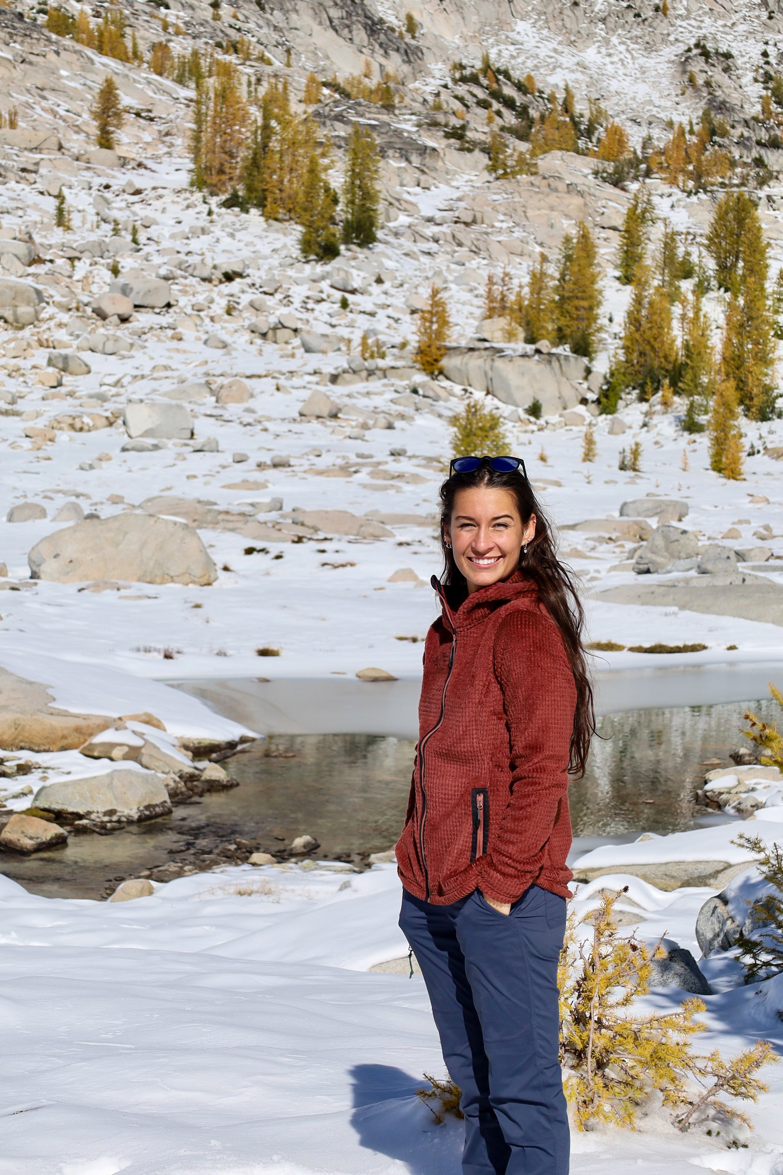 Women taking quick break while hiking the Enchantments while wearing a Alpha Aura