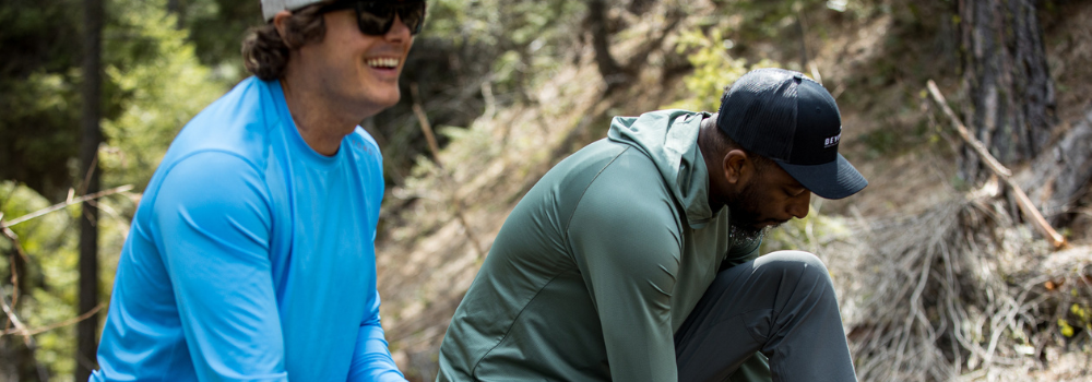 Men wearing the Azure Blue Geo-T Crew and Dark Mint Geo-T Hooded getting ready to go on a hike