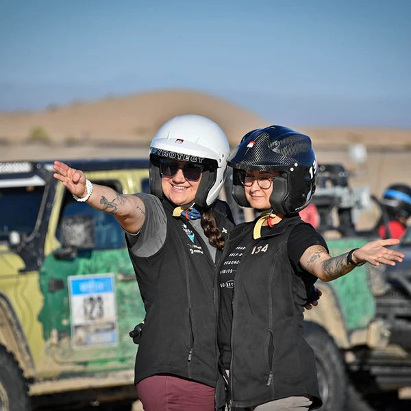 Rebelle Rally competitors with their helmets on.