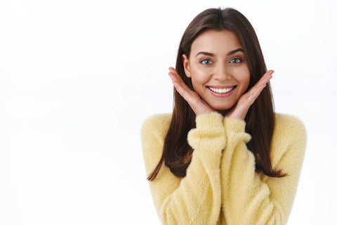 Girl with a happy reaction after using a pumpkin seed oil.