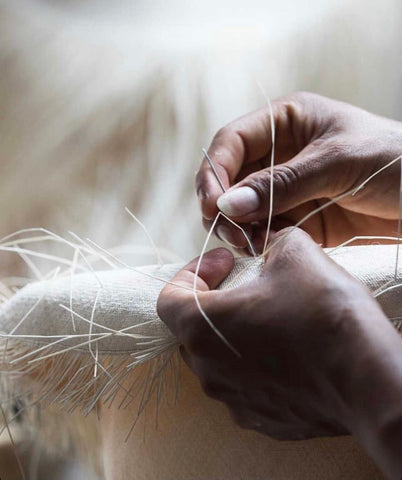 hand weaving a panama hat