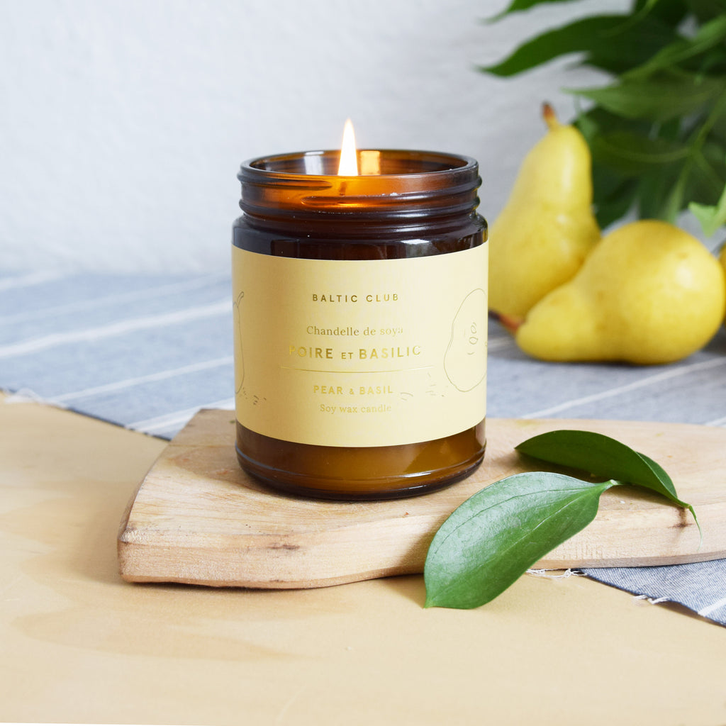 Baltic Club soy candle burning with Pears and Basil