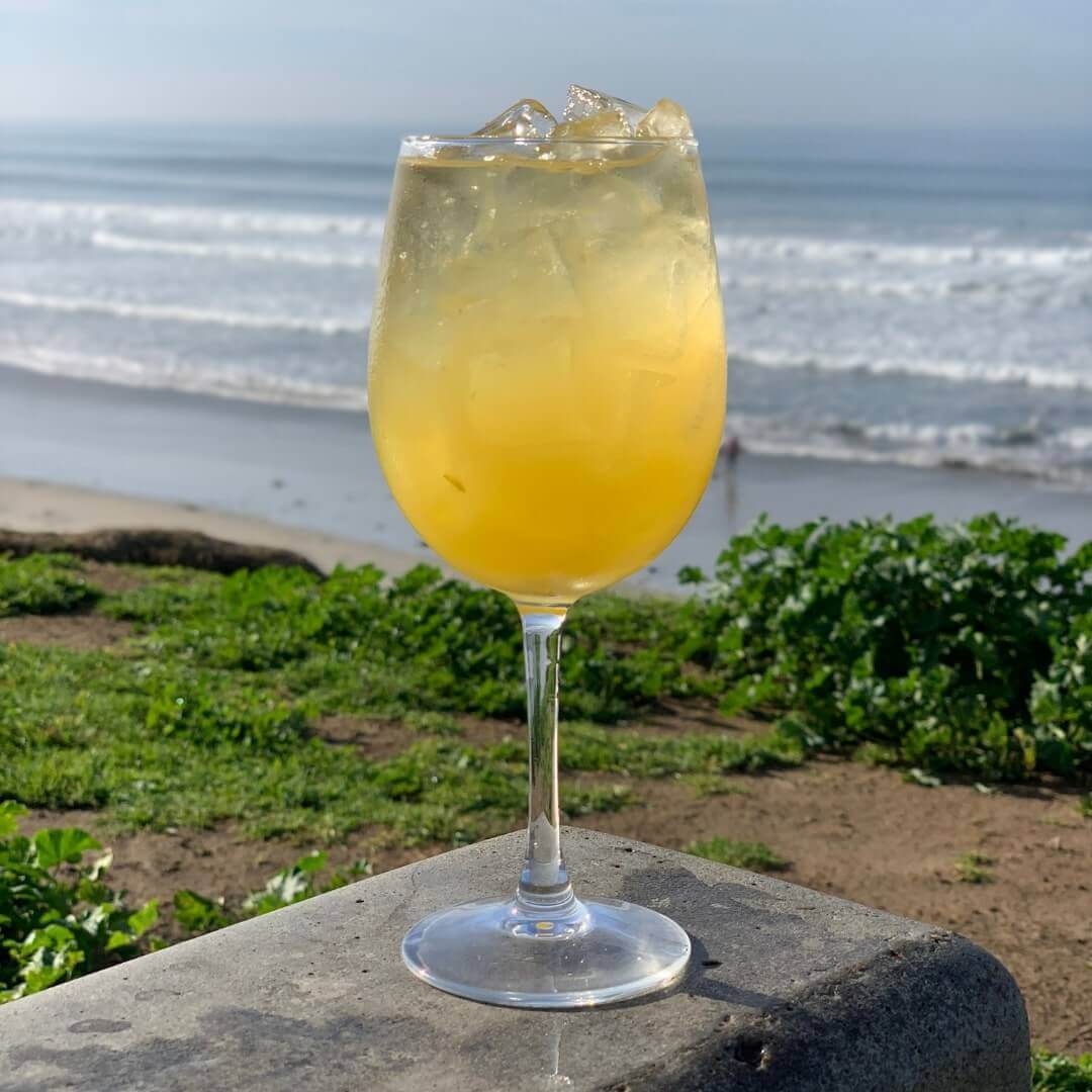 Brunch Mimosa - Draft champagne with a generous splash of passionfruit and pineapple cider - served in a flute or wine glass.
