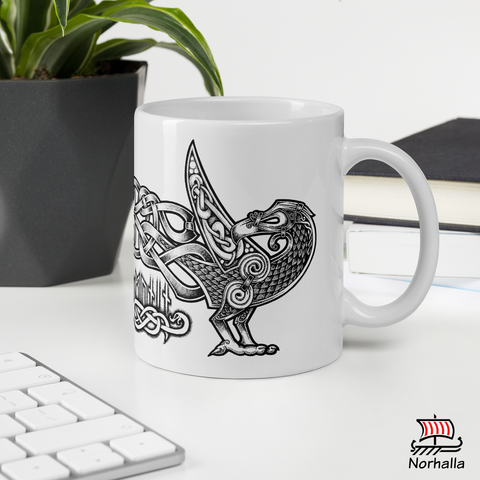 This beautiful ceramic mug is decorated with unique original art featuring Odin's ravens Hugin & Munin in classic Nordic knots and dot style by Swedish artist Micke Johansson. Norhalla.com