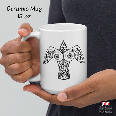 This beautiful ceramic mug is decorated with unique original art featuring a Raven in classic Nordic knots and dot style by Swedish artist Micke Johansson. Norhalla.com
