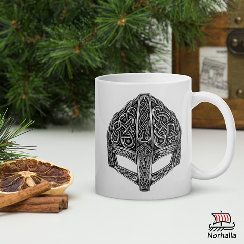 This beautiful ceramic mug is decorated with unique original art featuring a Viking helmet in classic Nordic knots and dot style by Swedish artist Micke Johansson. Norhalla.com