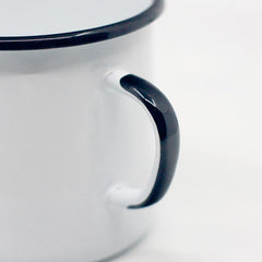 enamel mug with black handle detail