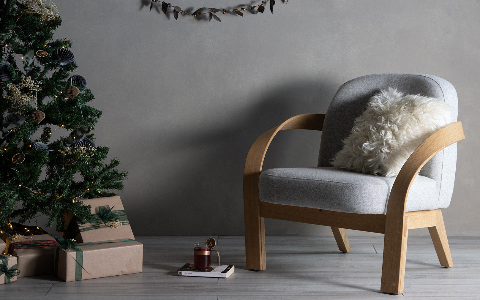 Arbor Armchair and Sheepskin cushion in christmas setting