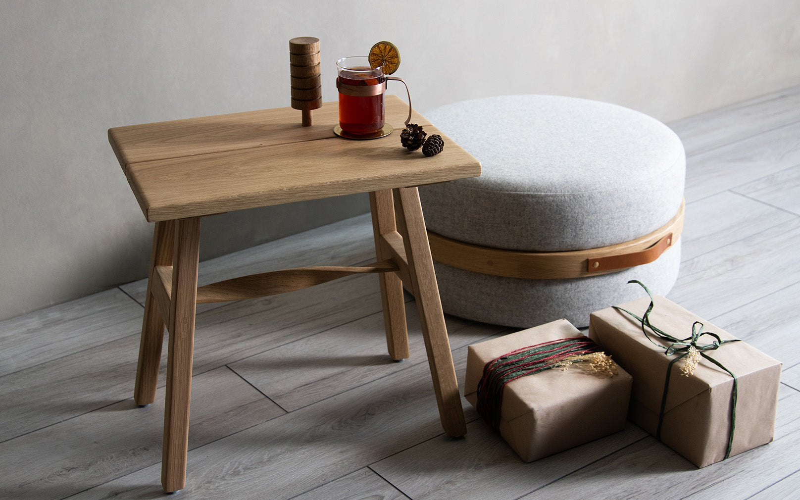 Tom Raffield Crib Stool and Beeble Pouffe in Christmas setting