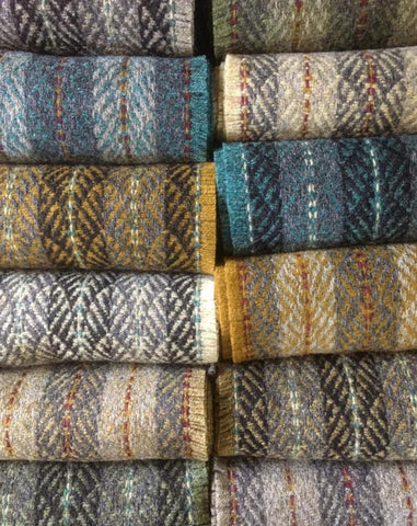 This stack of scarves by Sarah Tyssen is everything I love about fall weaving ~ @sarahtyssen