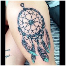 Dream catcher tattoo on thigh