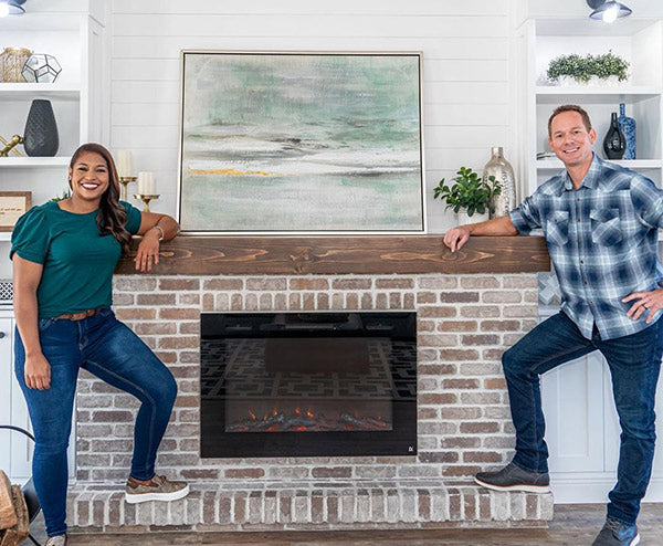 100 Day Dream Home, Mika and Brian Kleinschmidt in front of Touchstone Forte Electric Fireplace