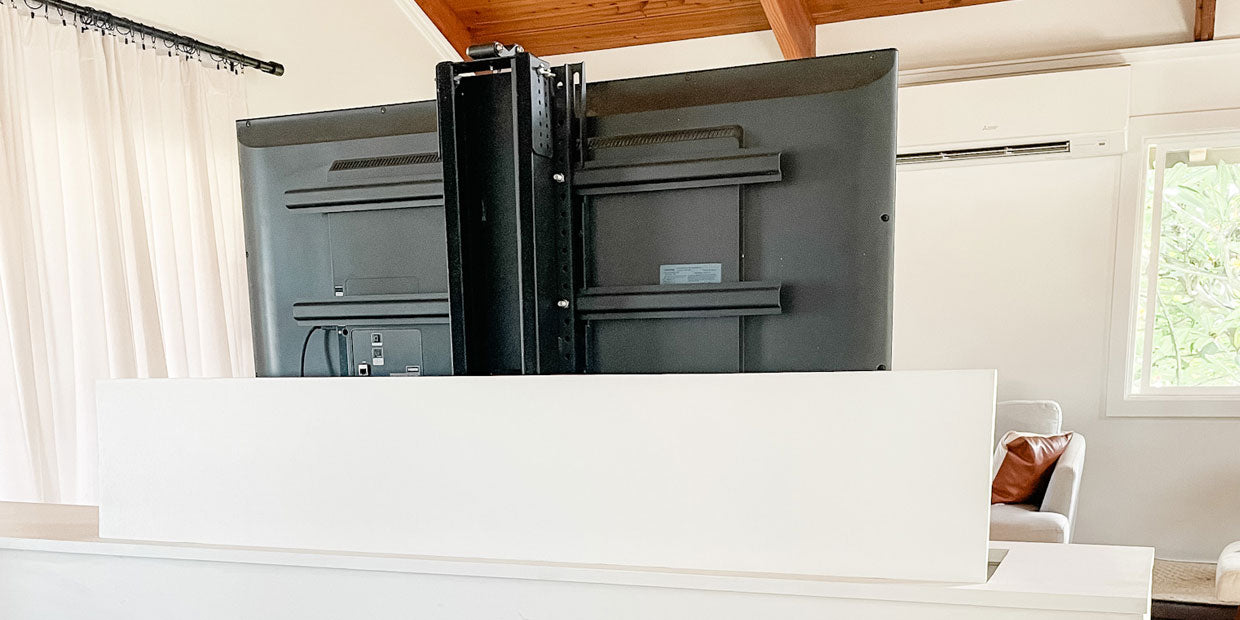 The back view of the Touchstone Whisper Lift PRO TV lift mechanism with TV attached to brackets in custom cabinet by @sachilord