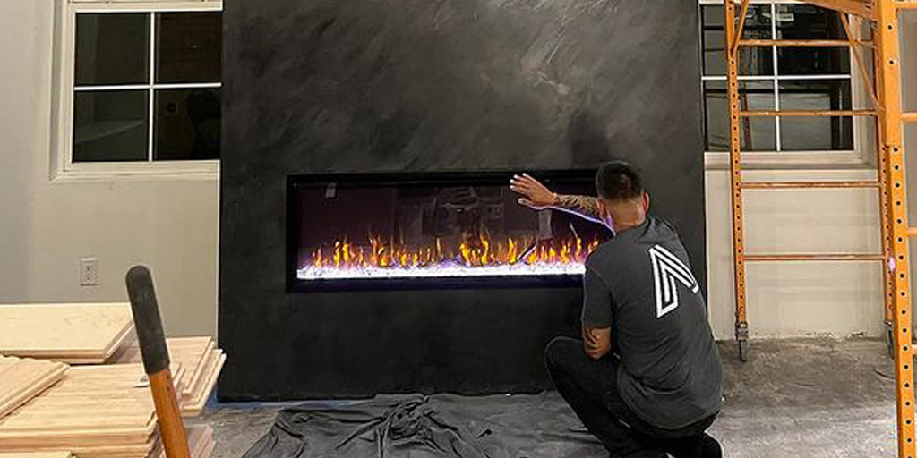 The Touchstone Sideline Elite Smart Electric Fireplace in Hermogeno Designs accent wall is cool to the touch