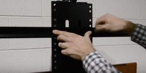 Attach the TV mounting brackets and TV to the WhisperLift II TV lift mechanism.