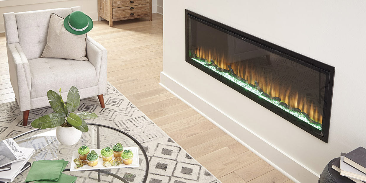 Touchstone Sideline Elite Electric Fireplace with orange flames and green flame base to celebrate St. Patricks Day