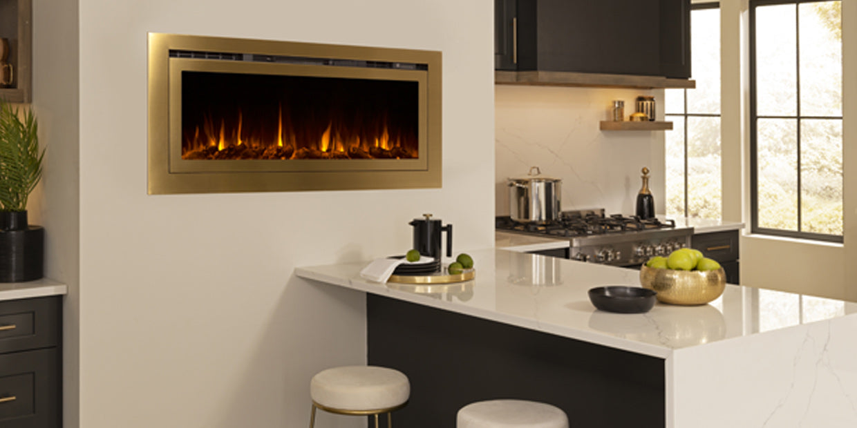 Touchstone Sideline Deluxe Gold Smart Electric Fireplace in the kitchen blends with the brushed gold fixtures.