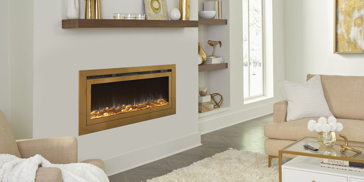 Touchstone Sideline Gold Electric Fireplace in bump out wall shown with orange white flames and logs.