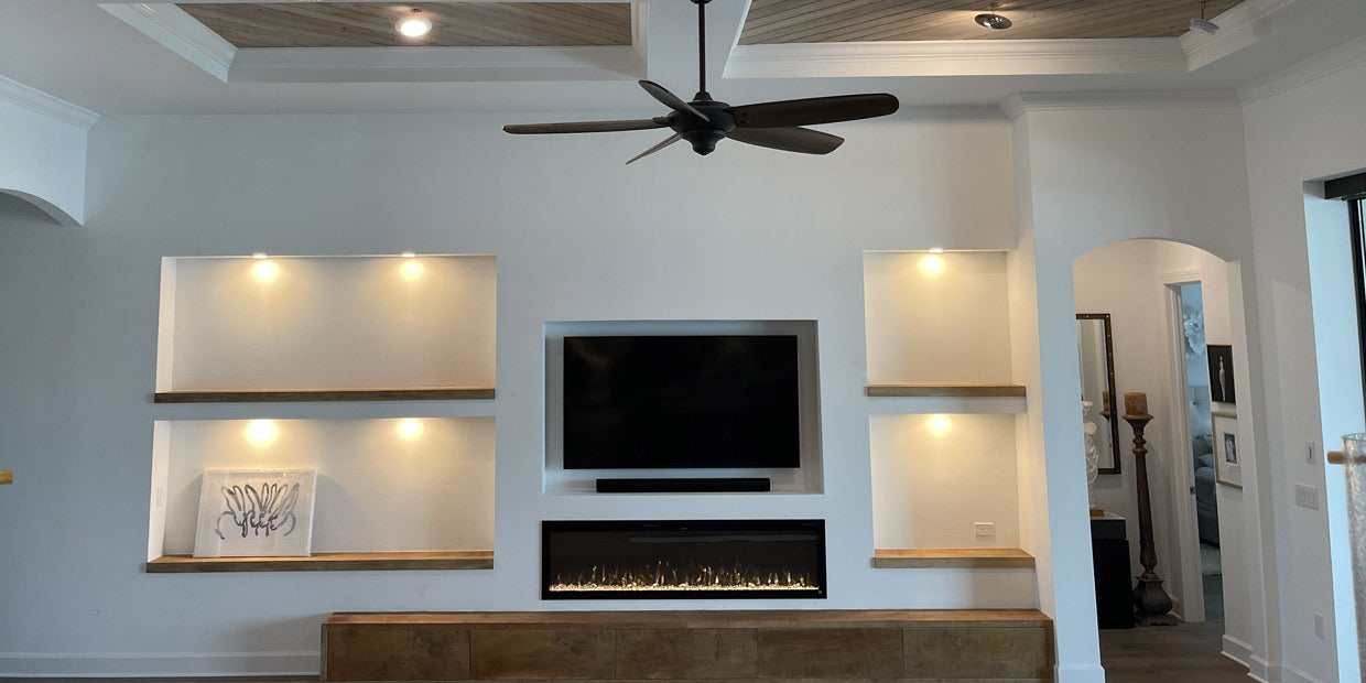 Umbare Home Remodel Online features a Touchstone electric fireplace in this accent wall renovation