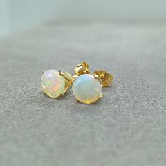 Opal stud earrings close up