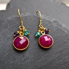 Ruby circle earrings in close up