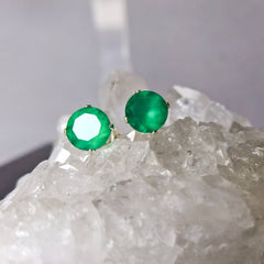 Marie Nicole Bijoux - Green Onyx stud earrings resting on a crystal base